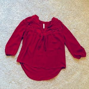 Bohemian chic top with tassels. 3/4 length sleeves. Rust color, flattering fit.